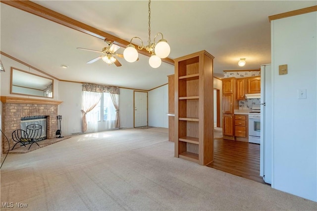 18592 Edwards Rd Unit 1, Doylestown, OH 44230 - unfurnished living room with light carpet, ornamental molding, a fireplace, a ceiling fan, and a chandelier