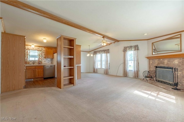 18592 Edwards Rd Unit 1, Doylestown, OH 44230 - unfurnished living room featuring light colored carpet, a brick fireplace, a ceiling fan, and crown molding