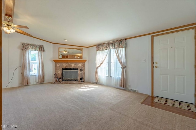 18592 Edwards Rd Unit 1, Doylestown, OH 44230 - unfurnished living room with a ceiling fan, a fireplace, crown molding, and carpet floors