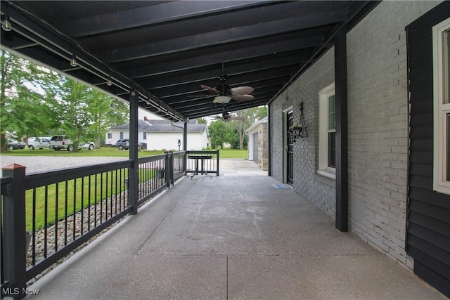 3316 S Canfield Niles Rd, Canfield, OH 44406 - porch with ceiling fan, a yard, and a residential view