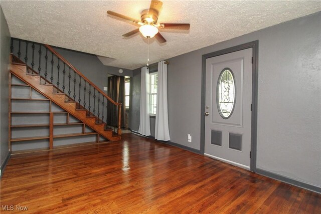 3316 S Canfield Niles Rd, Canfield, OH 44406 - foyer entrance featuring a textured ceiling, wood finished floors, stairs, and a ceiling fan