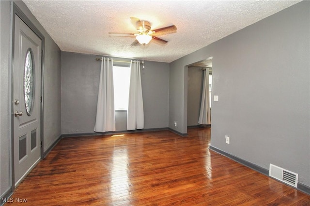 3316 S Canfield Niles Rd, Canfield, OH 44406 - spare room featuring a textured ceiling, ceiling fan, and wood finished floors