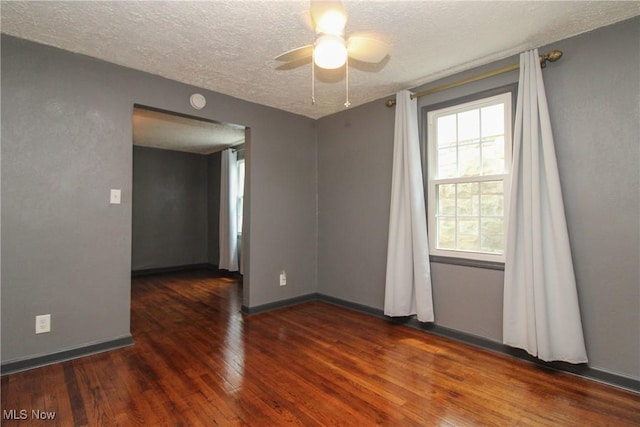 3316 S Canfield Niles Rd, Canfield, OH 44406 - empty room featuring a textured ceiling, hardwood / wood-style flooring, and a ceiling fan