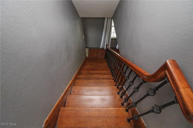 3316 S Canfield Niles Rd, Canfield, OH 44406 - stairs with a textured wall and wood finished floors