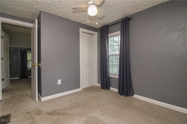 3316 S Canfield Niles Rd, Canfield, OH 44406 - unfurnished bedroom featuring carpet, a textured ceiling, ceiling fan, and a closet
