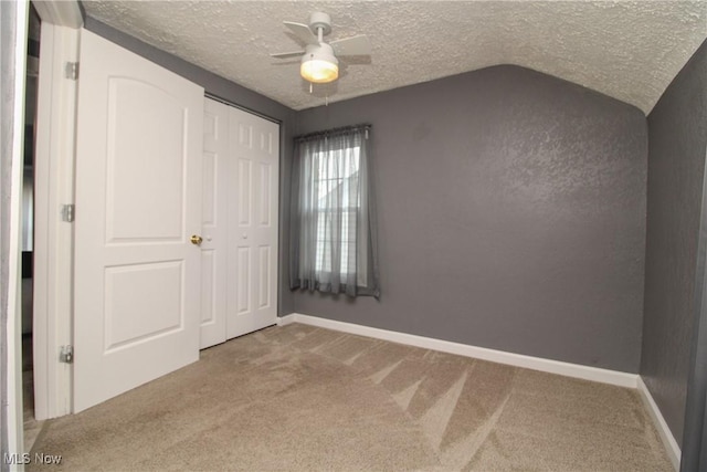 3316 S Canfield Niles Rd, Canfield, OH 44406 - unfurnished bedroom featuring carpet floors, a textured ceiling, a closet, and a ceiling fan
