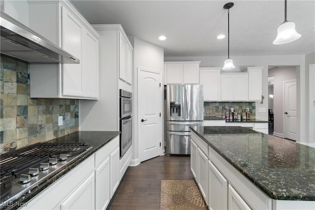 7319 Montella Ave NW, Canal Fulton, OH 44614 - kitchen with stainless steel appliances, ventilation hood, white cabinets, backsplash, and dark wood-style floors