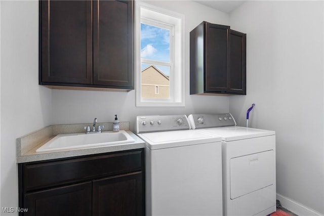 7319 Montella Ave NW, Canal Fulton, OH 44614 - laundry room featuring cabinet space and washer and clothes dryer