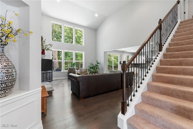 7319 Montella Ave NW, Canal Fulton, OH 44614 - living room featuring high vaulted ceiling, stairs, wood finished floors, and recessed lighting