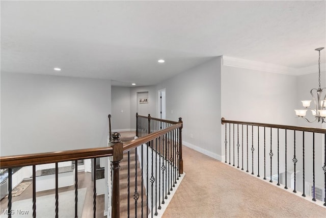 7319 Montella Ave NW, Canal Fulton, OH 44614 - hall with a chandelier, recessed lighting, carpet floors, and an upstairs landing