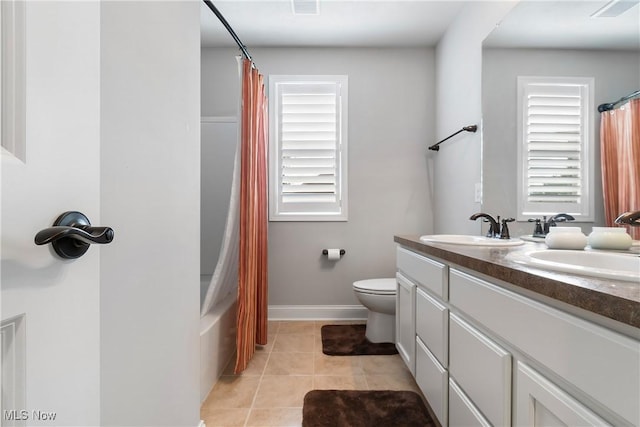 7319 Montella Ave NW, Canal Fulton, OH 44614 - full bathroom with double vanity, tile patterned floors, and shower / bath combo