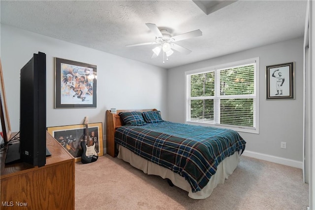 7319 Montella Ave NW, Canal Fulton, OH 44614 - bedroom featuring light colored carpet, ceiling fan, and a textured ceiling