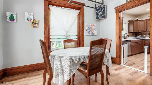 576 N Main St, Utica, OH 43080 - dining room with light wood-style flooring and baseboards