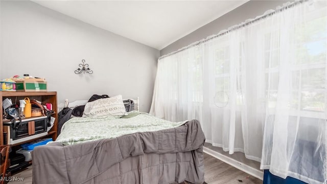 576 N Main St, Utica, OH 43080 - bedroom with vaulted ceiling and wood finished floors