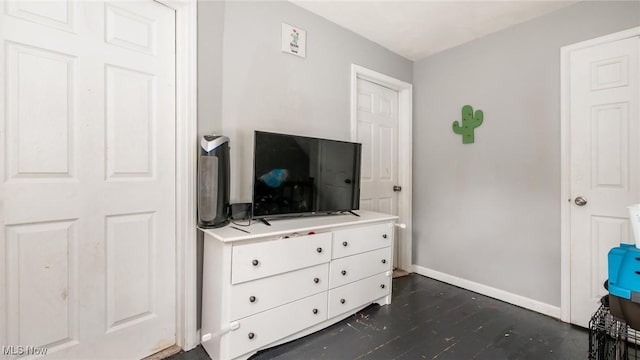 576 N Main St, Utica, OH 43080 - bedroom featuring baseboards and dark wood-style floors