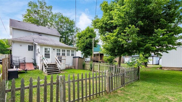 576 N Main St, Utica, OH 43080 - rear view of property featuring a storage unit and a fenced backyard