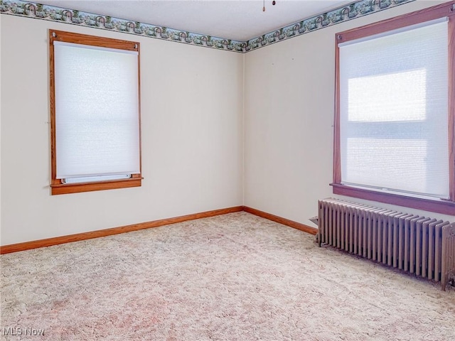 1120 N 5th St, Toronto, OH 43964 - spare room featuring radiator and carpet