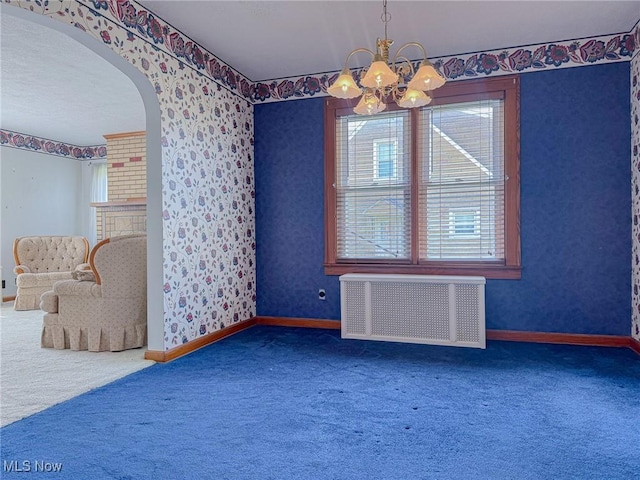 1120 N 5th St, Toronto, OH 43964 - unfurnished dining area with radiator, carpet flooring, wallpapered walls, healthy amount of natural light, and a chandelier