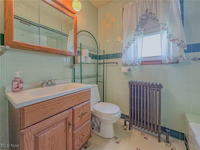 1120 N 5th St, Toronto, OH 43964 - bathroom featuring tile walls, radiator, vanity, tile patterned flooring, and decorative backsplash