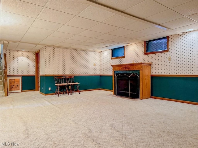 1120 N 5th St, Toronto, OH 43964 - finished basement featuring wallpapered walls, a drop ceiling, carpet flooring, and a high end fireplace
