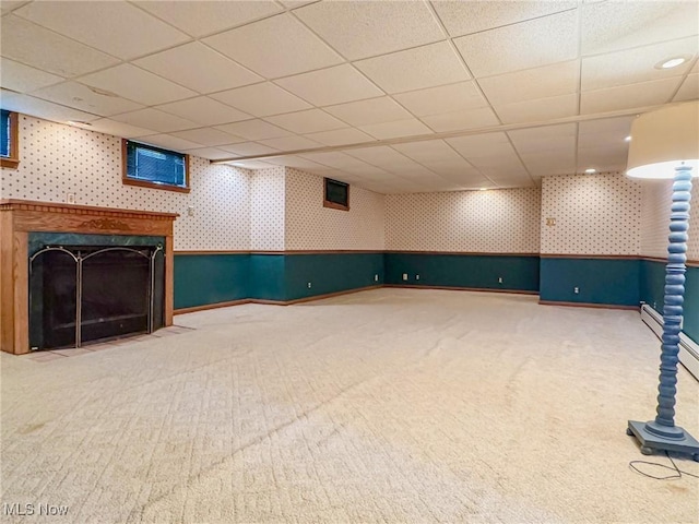 1120 N 5th St, Toronto, OH 43964 - finished basement with wallpapered walls, carpet flooring, a drop ceiling, and a premium fireplace