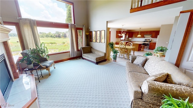 3383 Suffolk Downs, Stow, OH 44224 - living area with a towering ceiling, light carpet, and a fireplace with raised hearth