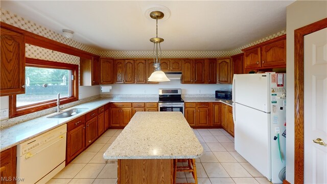 3383 Suffolk Downs, Stow, OH 44224 - kitchen with white appliances, light tile patterned floors, a kitchen island, pendant lighting, and exhaust hood