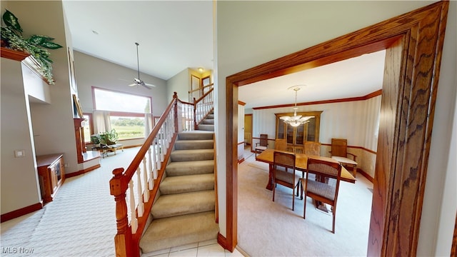 3383 Suffolk Downs, Stow, OH 44224 - stairs featuring carpet floors, a chandelier, and ceiling fan