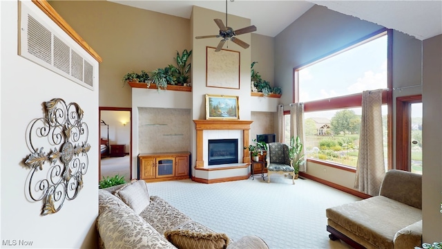 3383 Suffolk Downs, Stow, OH 44224 - living room featuring carpet floors, a tile fireplace, a ceiling fan, and healthy amount of natural light