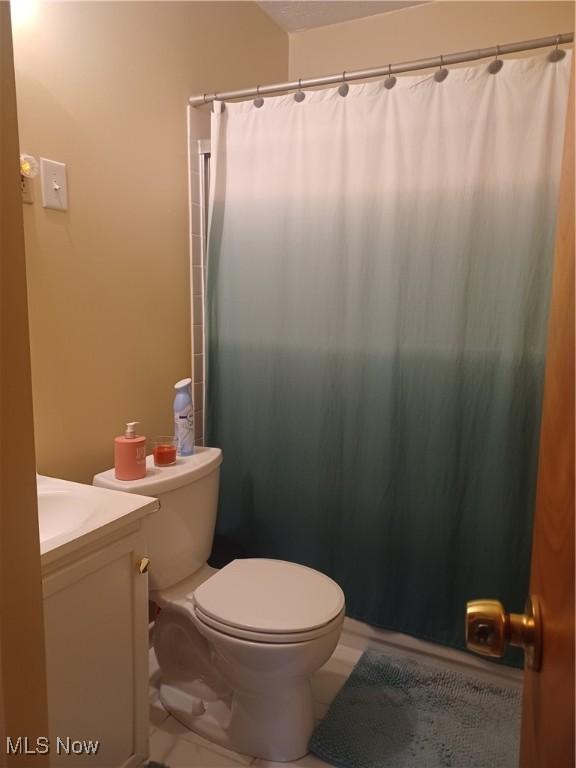 130 Fairground Blvd, Canfield, OH 44406 - full bathroom featuring vanity, tile patterned flooring, and a shower with curtain