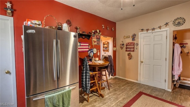 217 Mclaughlin Ave, Byesville, OH 43723 - kitchen with freestanding refrigerator and wood finished floors