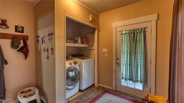 217 Mclaughlin Ave, Byesville, OH 43723 - laundry room featuring washing machine and dryer, wood finished floors, and a textured ceiling