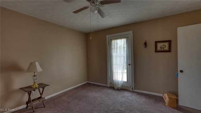 217 Mclaughlin Ave, Byesville, OH 43723 - carpeted spare room featuring a ceiling fan and a textured ceiling
