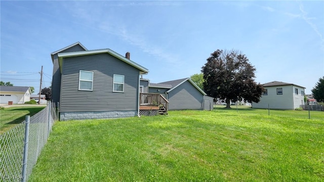 217 Mclaughlin Ave, Byesville, OH 43723 - back of house featuring a fenced backyard, a chimney, and a deck