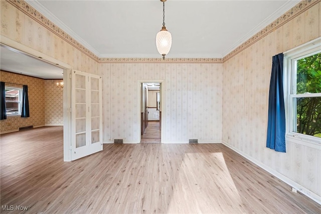 158 Elm St, Leetonia, OH 44431 - empty room featuring wood finished floors, ornamental molding, a chandelier, and french doors