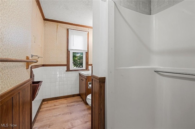 158 Elm St, Leetonia, OH 44431 - bathroom with wallpapered walls, vanity, wood finished floors, a wainscoted wall, and crown molding