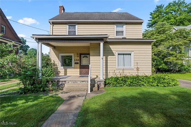 158 Elm St, Leetonia, OH 44431 - view of front facade featuring a porch, a front yard, and a chimney