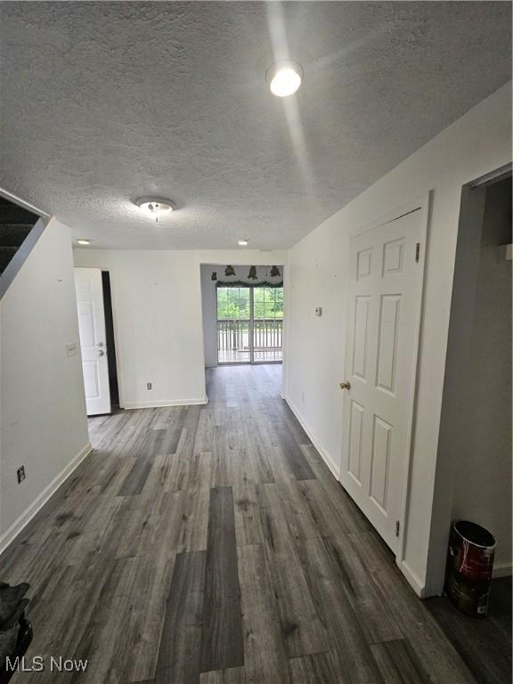 5860 Kirk Rd, Canfield, OH 44406 - spare room featuring dark wood finished floors and a textured ceiling