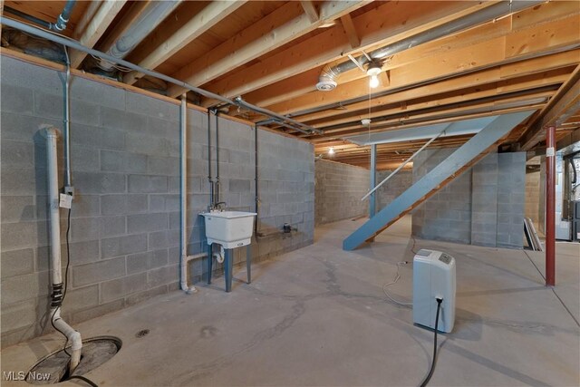 233 Robbies Run, Cortland, OH 44410 - unfinished basement with stairway and a sink
