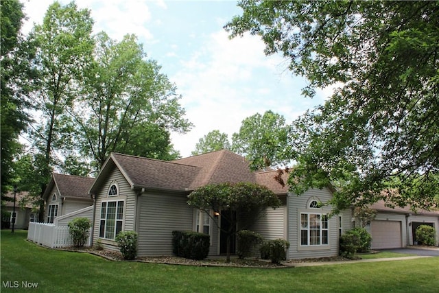 9 Hunters Woods Blvd Unit B, Canfield, OH 44406 - view of front facade with a shingled roof, a front yard, and driveway