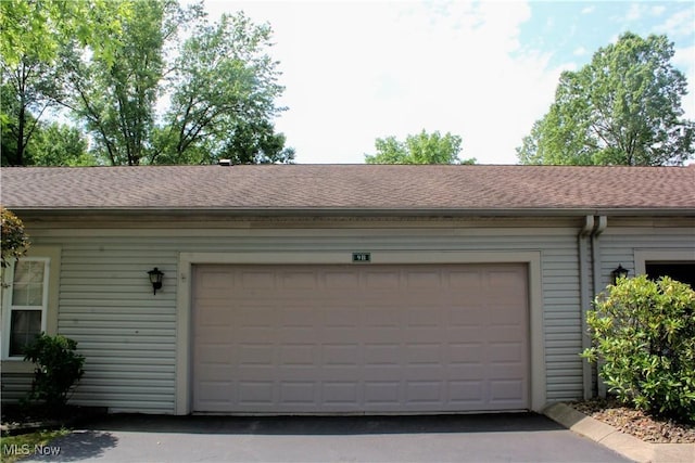 9 Hunters Woods Blvd Unit B, Canfield, OH 44406 - garage featuring asphalt driveway