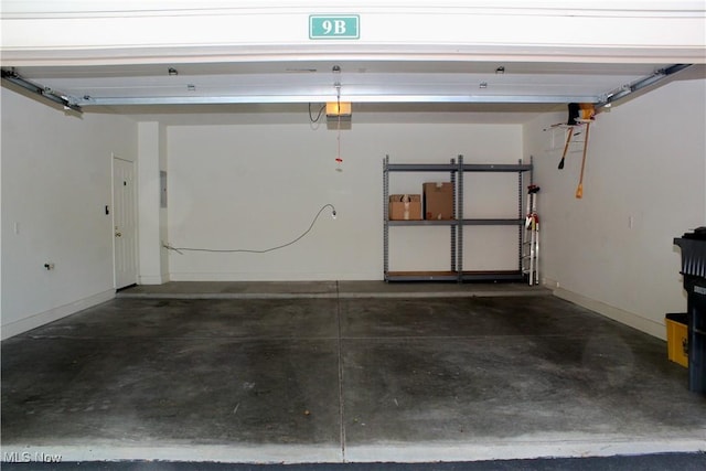9 Hunters Woods Blvd Unit B, Canfield, OH 44406 - garage featuring a garage door opener