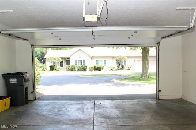 9 Hunters Woods Blvd Unit B, Canfield, OH 44406 - garage featuring a garage door opener