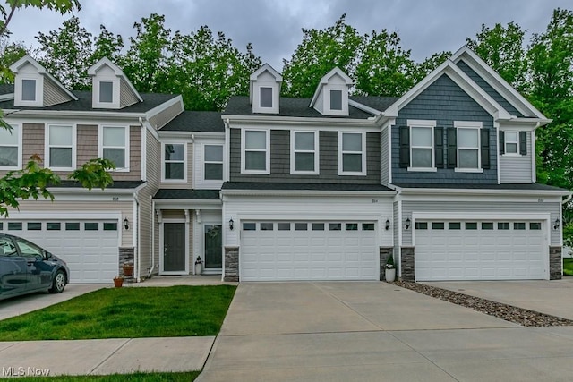 864 Woodside Dr, Westlake, OH 44145 - multi unit property featuring stone siding and an attached garage