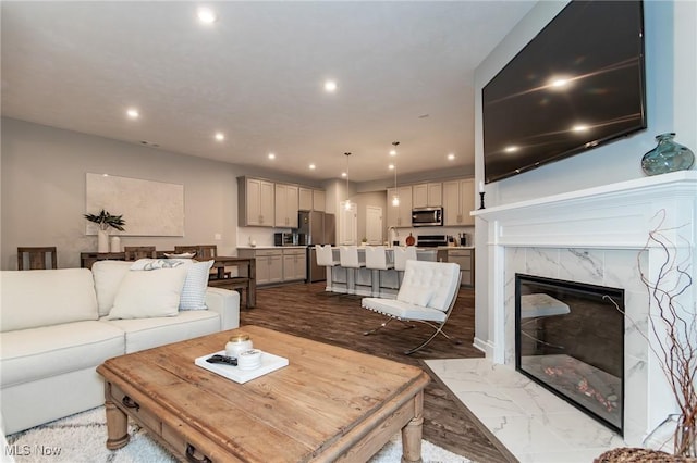 864 Woodside Dr, Westlake, OH 44145 - living area with recessed lighting, a high end fireplace, and marble finish floors
