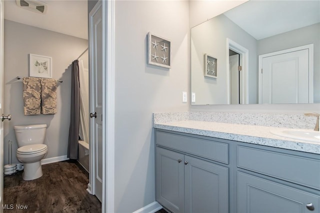 864 Woodside Dr, Westlake, OH 44145 - full bath with vanity, wood finished floors, and shower / bath combo with shower curtain