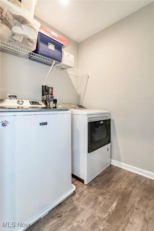 864 Woodside Dr, Westlake, OH 44145 - laundry area with independent washer and dryer and light wood-style floors