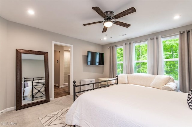 864 Woodside Dr, Westlake, OH 44145 - bedroom featuring light colored carpet, multiple windows, recessed lighting, ensuite bathroom, and a ceiling fan