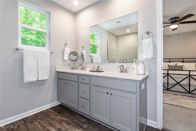 864 Woodside Dr, Westlake, OH 44145 - bathroom featuring double vanity, healthy amount of natural light, a ceiling fan, and a tile shower