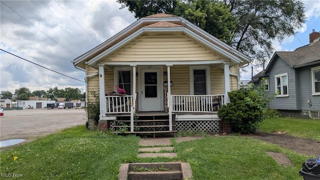 1549 Quimby Ave SW, Canton, OH 44706 - view of front of property with a porch and a front yard